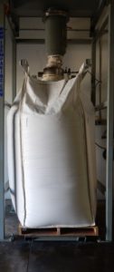 bulk bag on wooden crate inside warehouse